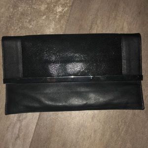 Black clutch with unused strap